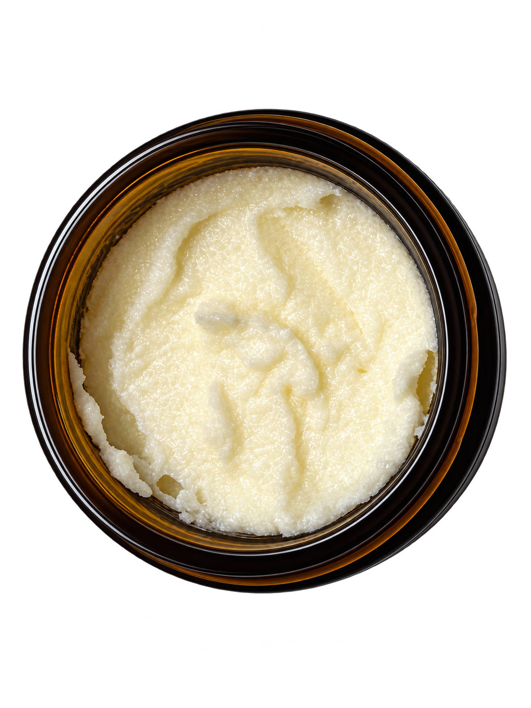 Open jar of Tallow Sugar Scrub seen from above, showing the fine sugar texture