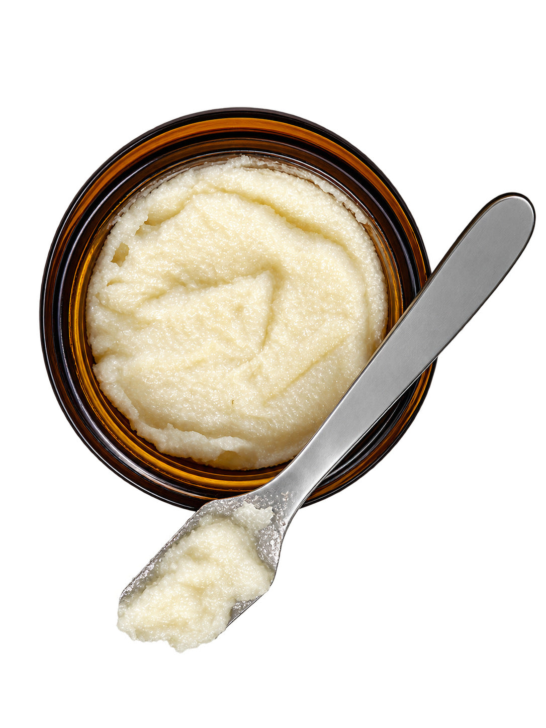 Open jar of Tallow Sugar Scrub seen from above with a scoop of scrub on a small metal spatula